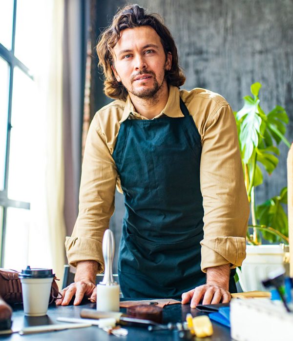 handsome-tanner-master-tailor-in-a-work-apron-work-resize.jpg